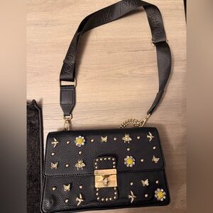 Betsy Johnson black with gold accents purse.